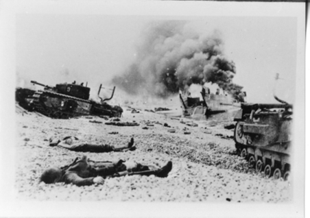 Tanks and men lying on the Dieppe Beach.