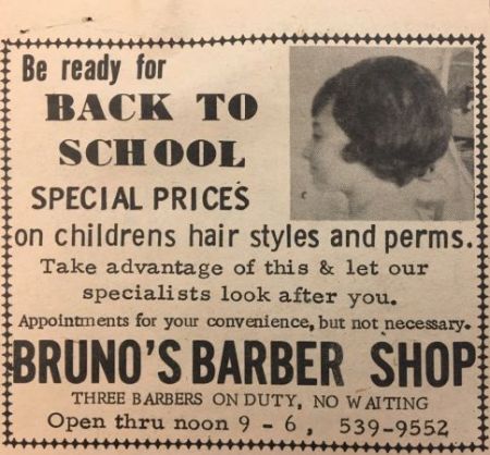  Barbershop ad with a woman modeling a haircut.