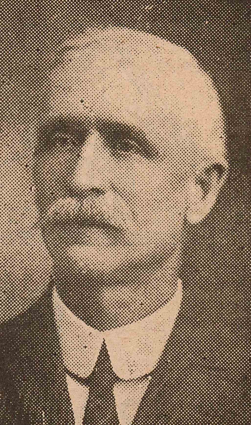 Portrait of William McGuire. McGuire has a mustache and his wearing a suit.
